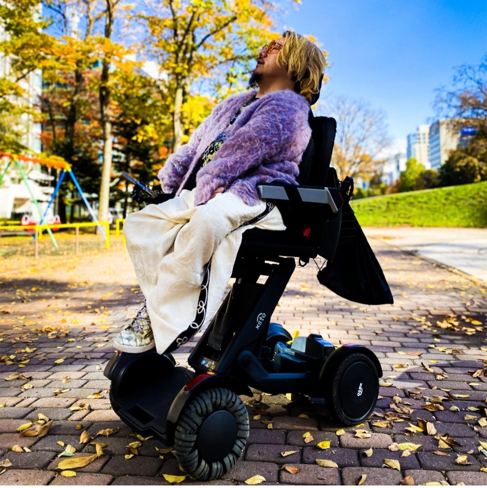 Man with disability in the X4 mobility scooter.